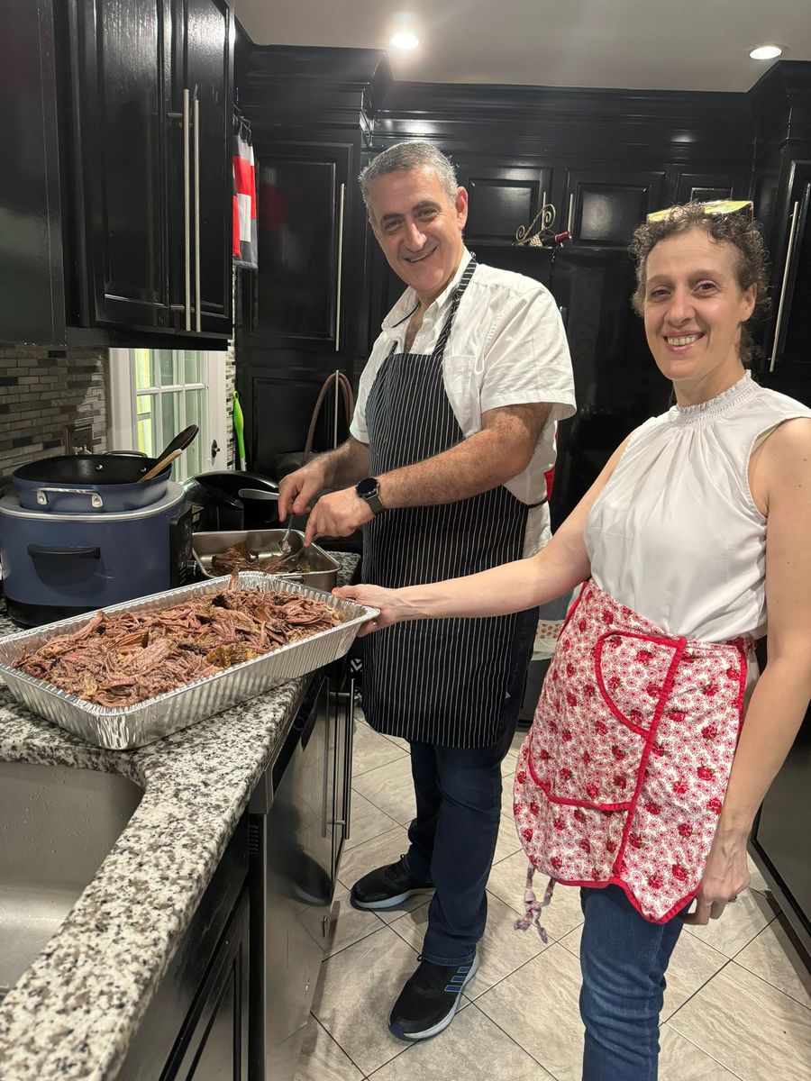 Chef Chadi Massoud and family preparing food together in the kitchen